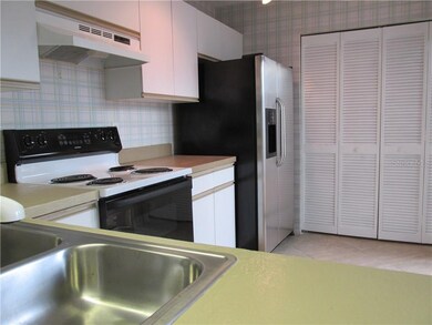 Large open kitchen and the laundry area, also with