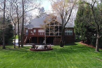 Rear of home.  Nice flat lot with fire pit area, C