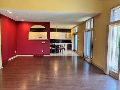 A reverse photo of the dining room area and the ki