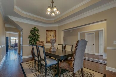 Elegant trey ceilings and crown moulding embellish this open, comfortable space.