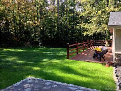 Exterior Front. A 1200 square foot deck was added 