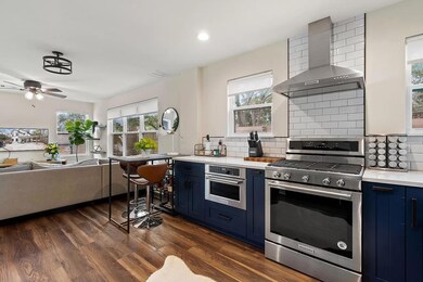 Kitchen with blue cabinetry, stainless steel appl