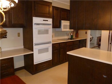 Kitchen. Kitchen has double ovens and solid surfac