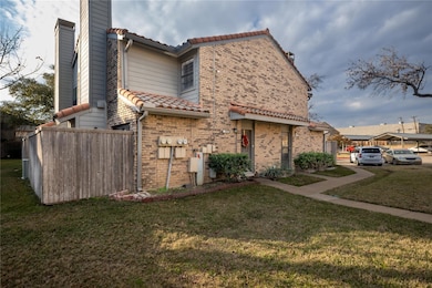 View of property exterior featuring a lawn