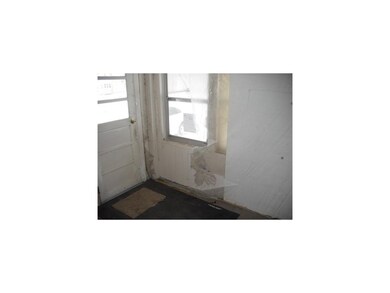 Porch. Enclosed porch in front of home