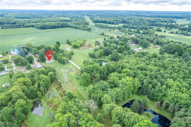 View of property location featuring rural landscape and a tree filled landscape