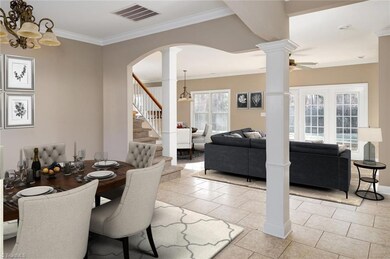 Open concept from dining room to living room with low maintenance tile