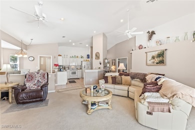 Living area with lofted ceiling, recessed lighting