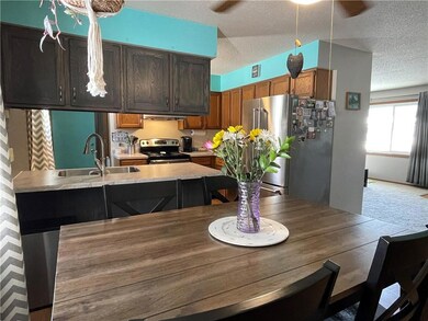 Dining area looking to kitchen area