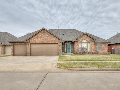 View of front of property with driveway, roof with