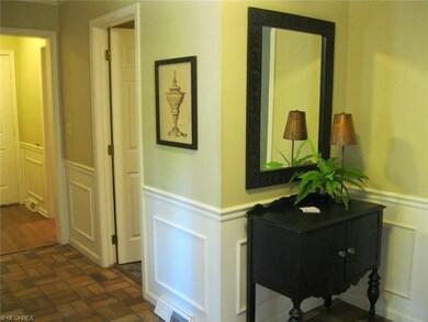 Foyer boasts wainscoting and chair-rail. Doorways 