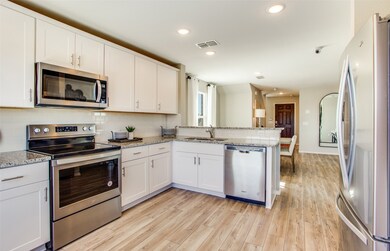High-end gourmet kitchen with premium finishes and upgraded appliances *Model representation
