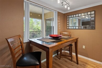 Dining room with wood finished floors, baseboards,