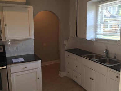Unit B Kitchen featuring tasteful backsplash, whit