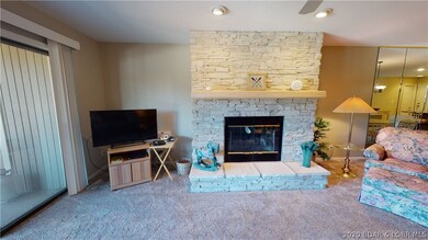 Main level  living room with wood burning fireplac