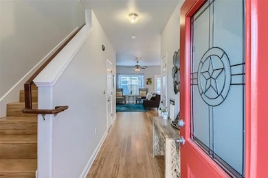 Entryway featuring stairway, light wood-style flo