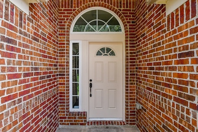 Charming entrance with a classic white door framed