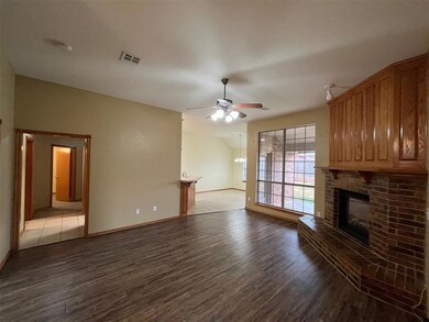 Unfurnished living room with ceiling fan, vaulted 