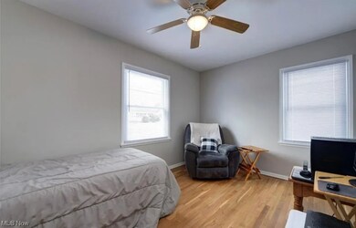 Bedroom featuring light wood flooring and ceiling fan