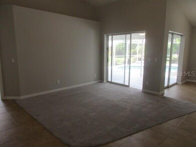 another view of living area from dining side of tiled walkway