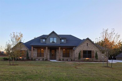 View of front of property featuring a front lawn