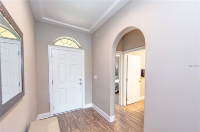 Wide open foyer and short hall to secondary bedroo