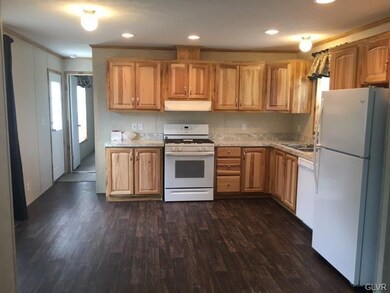CUSTOM KITCHEN WITH HICKORY CABINETRY AND APPLIANC