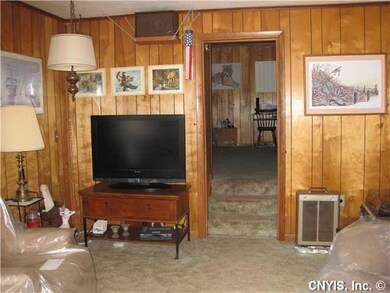 Living Room. Paneled living room, w/w carpet, look