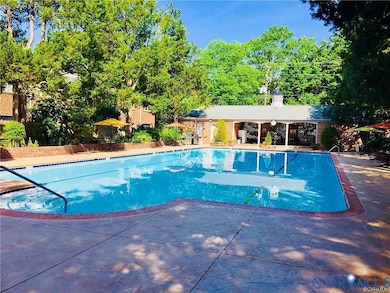 Community pool featuring a patio area