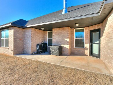 Back of house with a patio