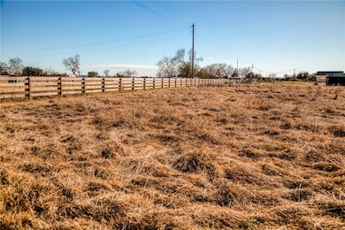 View of yard with a rural view