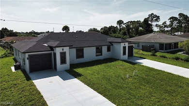 Ranch-style home with roof with shingles, stucco siding, driveway, a front yard, and an attached garage