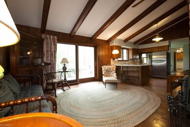 The family room extends from the kitchen and has high beamed ceilings. This can also be used as a dining room if that is your desire of course.