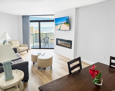 Living room featuring a wall of windows, wood fini