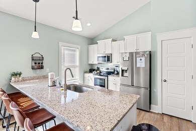 Kitchen with stainless steel appliances, a sink, a