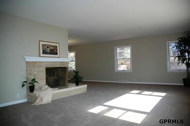 You won't find a large living room like this in most houses!  Corner wood-buring fireplace.