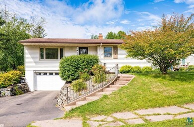 View of front of house featuring a front lawn and 