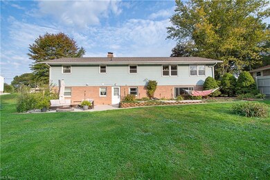 Walk-out to the gorgeous patio with a fire pit and to the partially fence-in backyard.