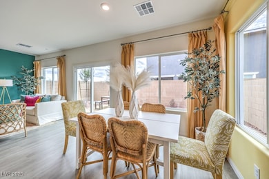 Dining space featuring recessed lighting and wood finished floors. Home is representational only; actual home finishes may vary.