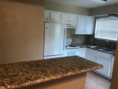 Granite countertops, tiled backsplash, and include