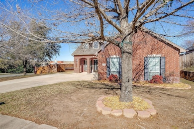 View of front of home featuring brick siding and driveway
