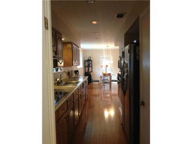 Kitchen. Great galley kitchen with wood floors flo