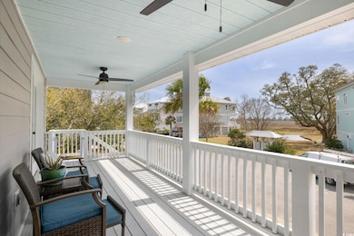 Front porch overlooks pond, marsh and water views