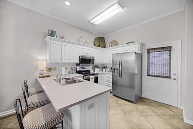 Kitchen featuring appliances with stainless steel 