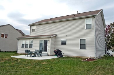This view is from the northeast and shows the north side of the home and the patio. 