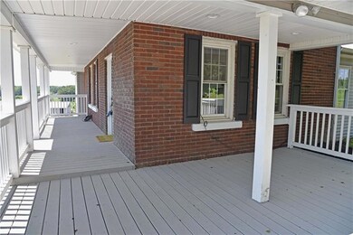 Enjoy the large wrap around front porch with famil