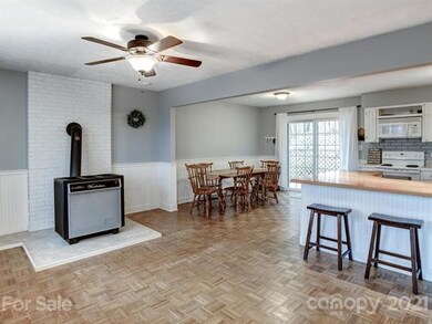 Living area with dining and breakfast bar.