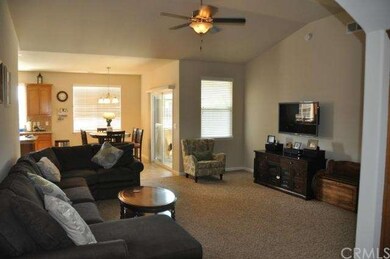 Living room open to dining room and kitchen. 