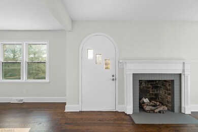 Restored hardwood floors and gas fireplace