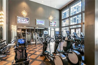 Gym featuring a wealth of natural light and a high
